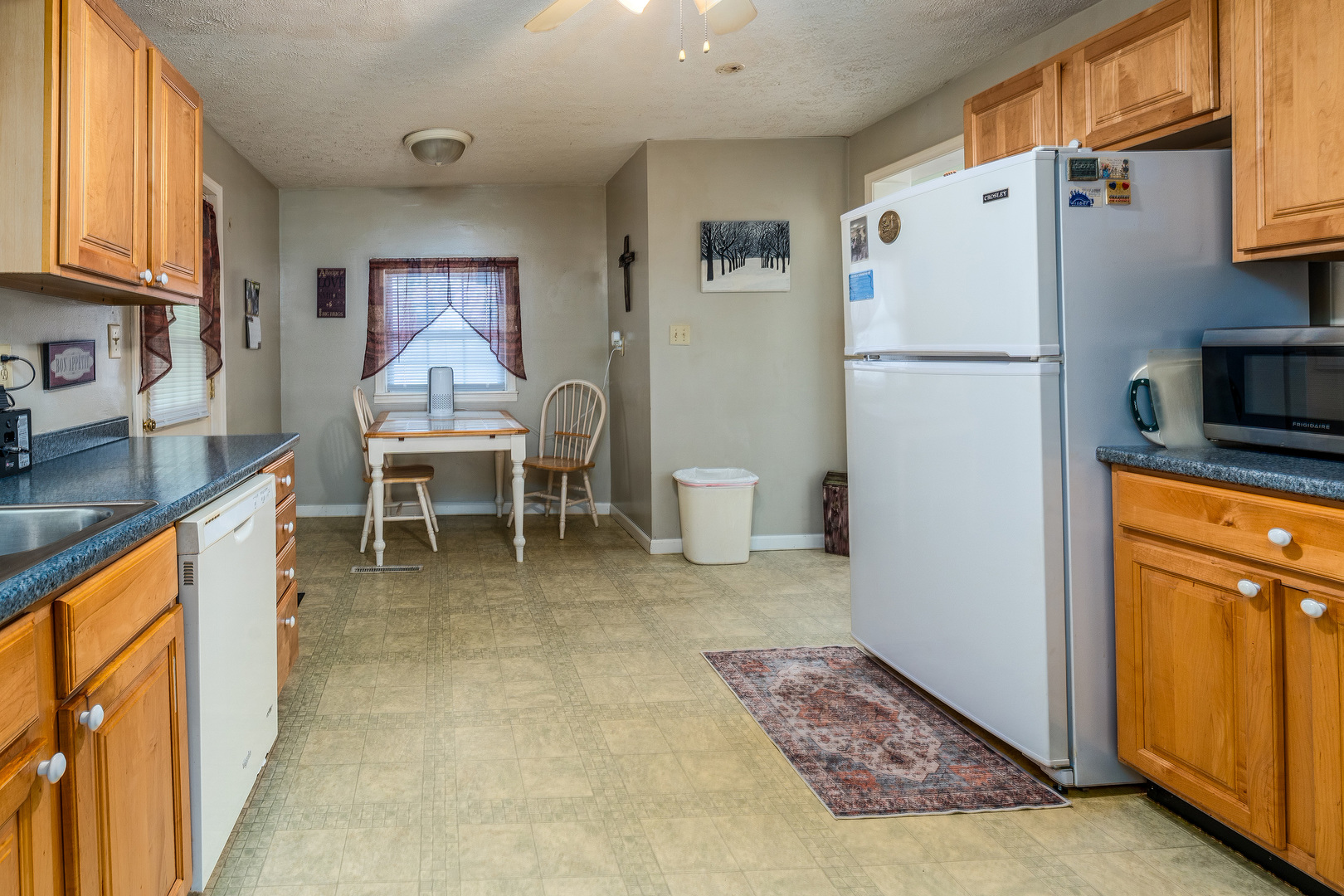 202 South Ervin Street Pittsburg, IL 62974 - Photo 12 of 42 a kitchen with stainless steel appliances granite countertop a refrigerator and a stove top oven