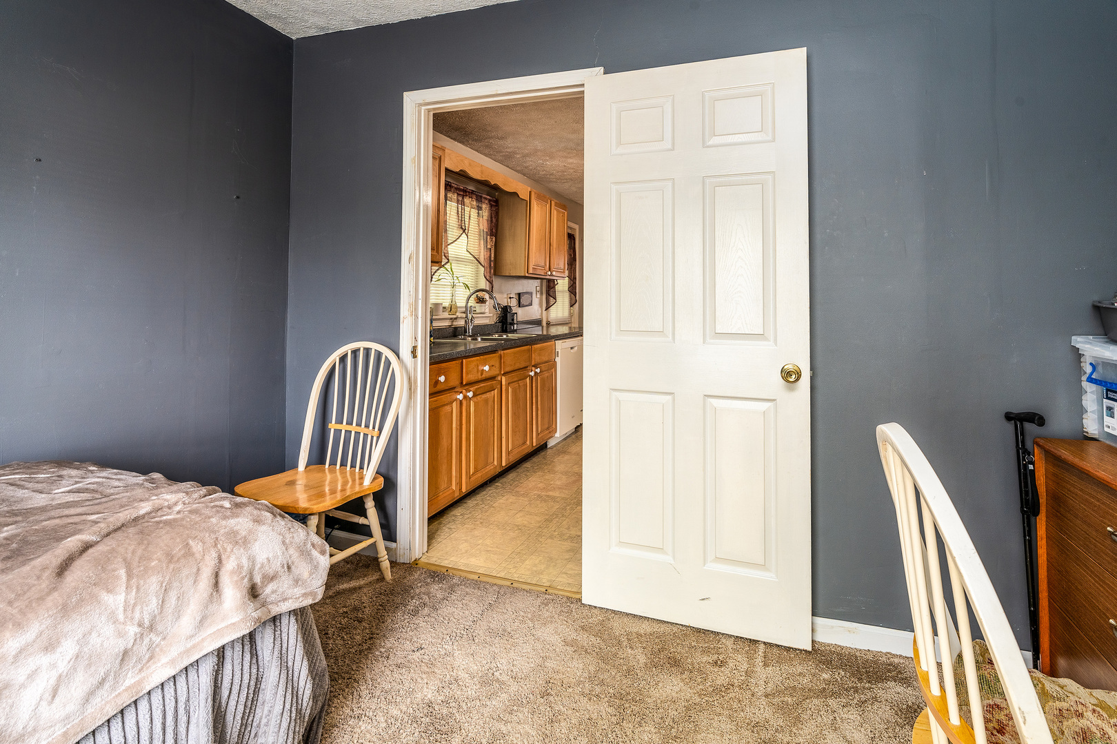 202 South Ervin Street Pittsburg, IL 62974 - Photo 17 of 42 a bedroom with a bed and wooden floor