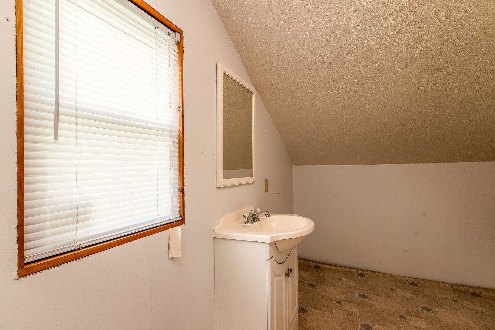 202 South Ervin Street Pittsburg, IL 62974 - Photo 27 of 42 a bathroom with a sink and mirror