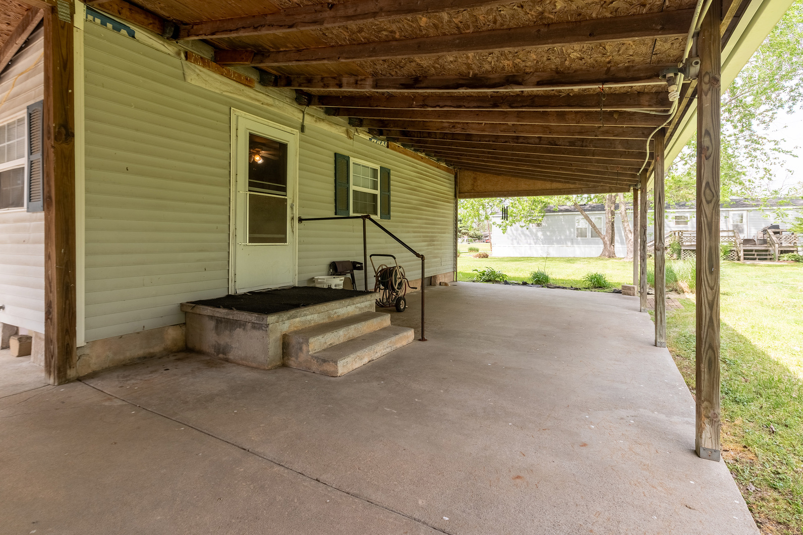 202 South Ervin Street Pittsburg, IL 62974 - Photo 29 of 42 a view of a porch with furniture and a backyard