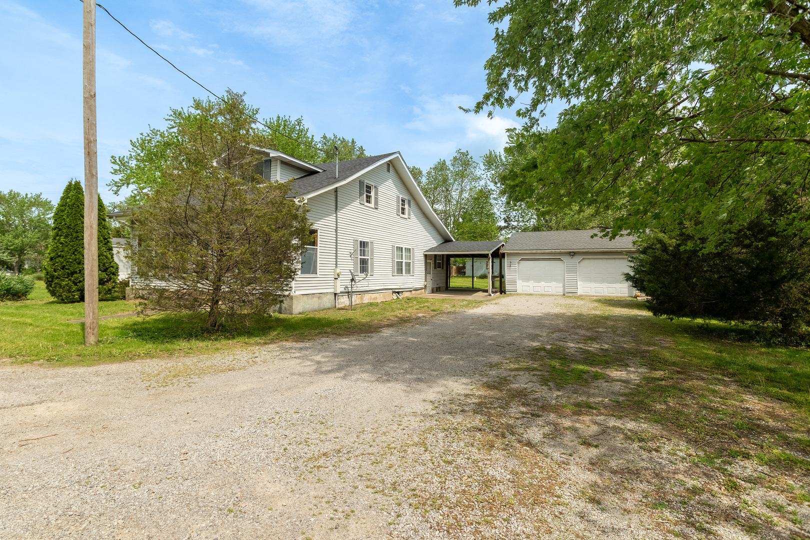 202 South Ervin Street Pittsburg, IL 62974 - Photo 3 of 42 a house with trees in front of it