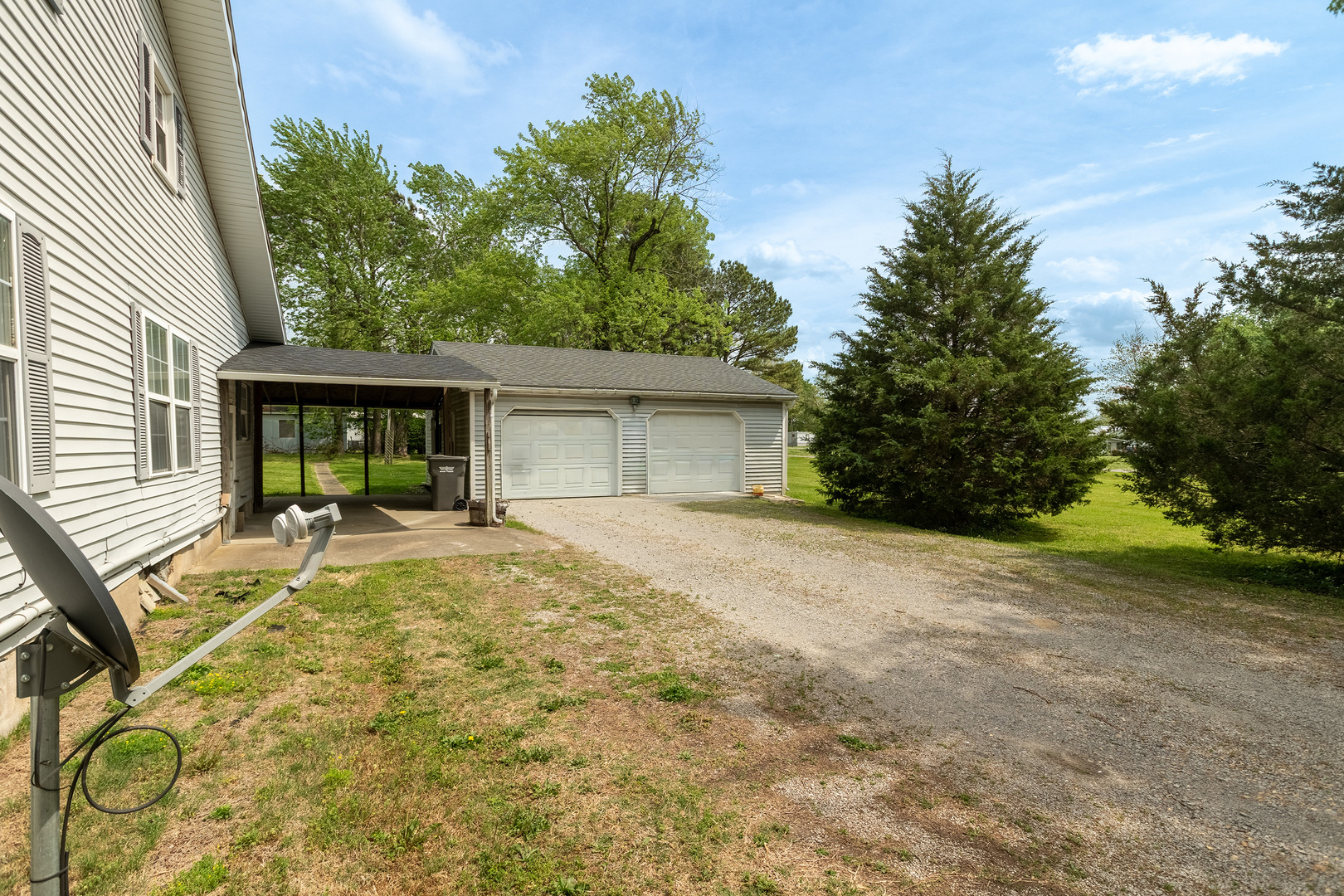 202 South Ervin Street Pittsburg, IL 62974 - Photo 32 of 42 a view of a house with backyard and sitting area