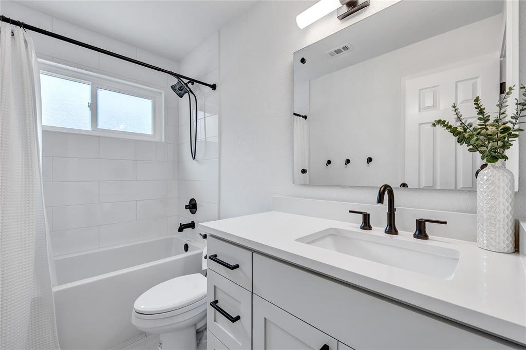 3600 Rip Ford Drive Austin, TX 78732 - Photo 26 of 32 a bathroom with a sink a toilet and shower