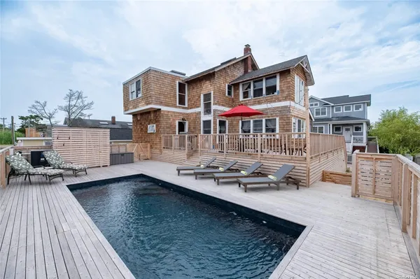 a front view of a house with swimming pool