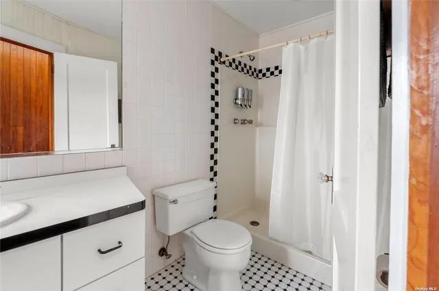 a bathroom with a toilet and a sink