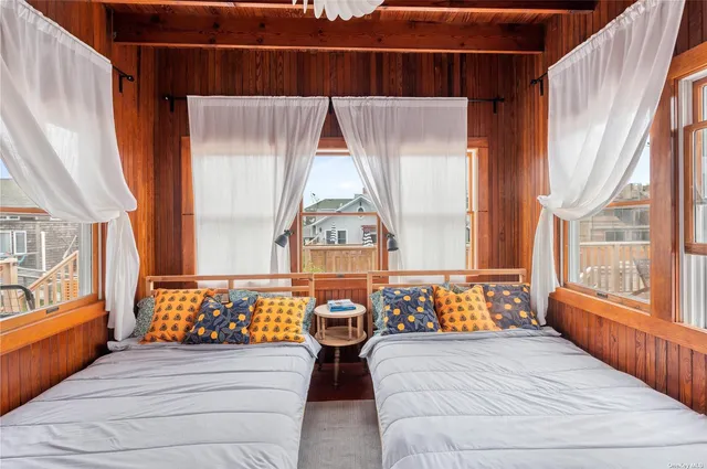 a bedroom with furniture and a window