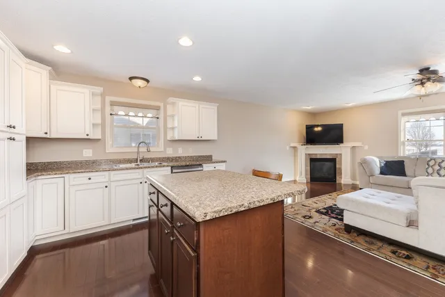 a kitchen with a sink stove and microwave