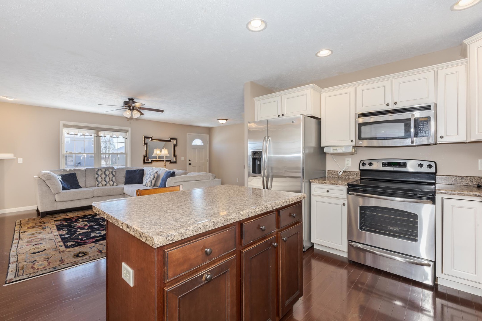 1646 Belclare Road Normal, IL 61761 - Photo 12 of 50 a kitchen with stainless steel appliances granite countertop a stove refrigerator and cabinets