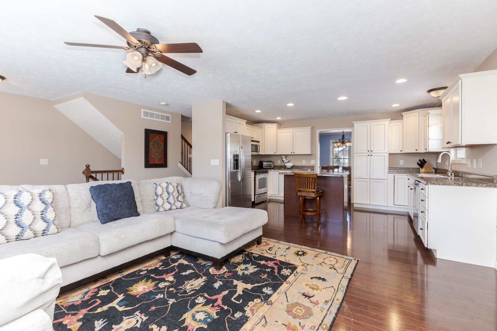 1646 Belclare Road Normal, IL 61761 - Photo 14 of 50 a living room with furniture and kitchen view