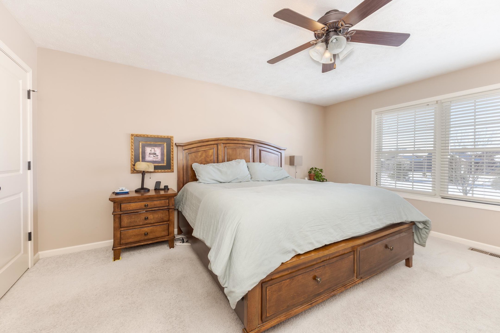 1646 Belclare Road Normal, IL 61761 - Photo 26 of 50 a spacious bedroom with a bed and a window
