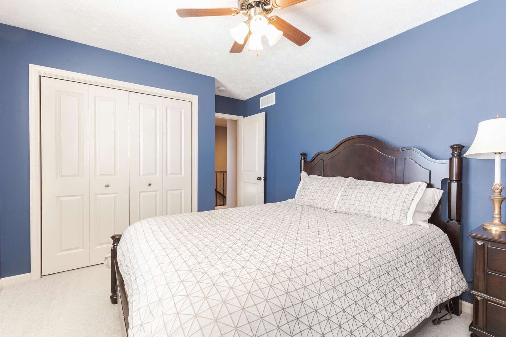 1646 Belclare Road Normal, IL 61761 - Photo 30 of 50 a bedroom with a bed and a chandelier