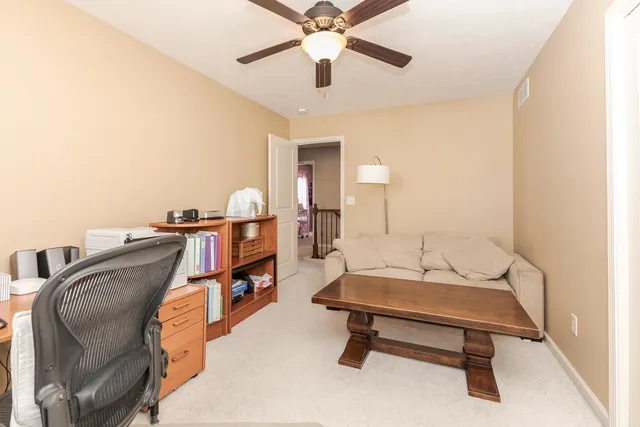 a living room with furniture and a rug