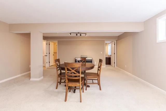 a dining room with furniture and window