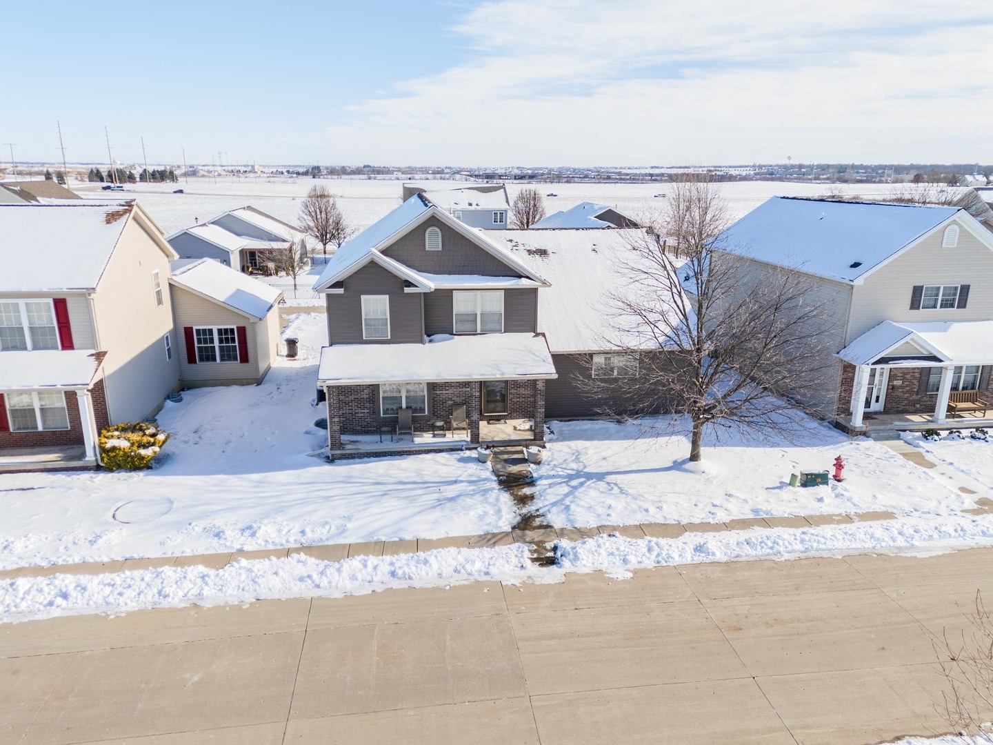 1646 Belclare Road Normal, IL 61761 - Photo 4 of 50 a view of a house with a snow on the road