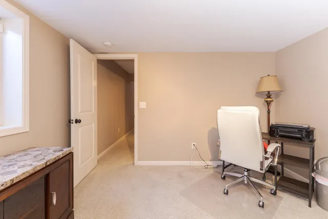 a view of a workspace with furniture