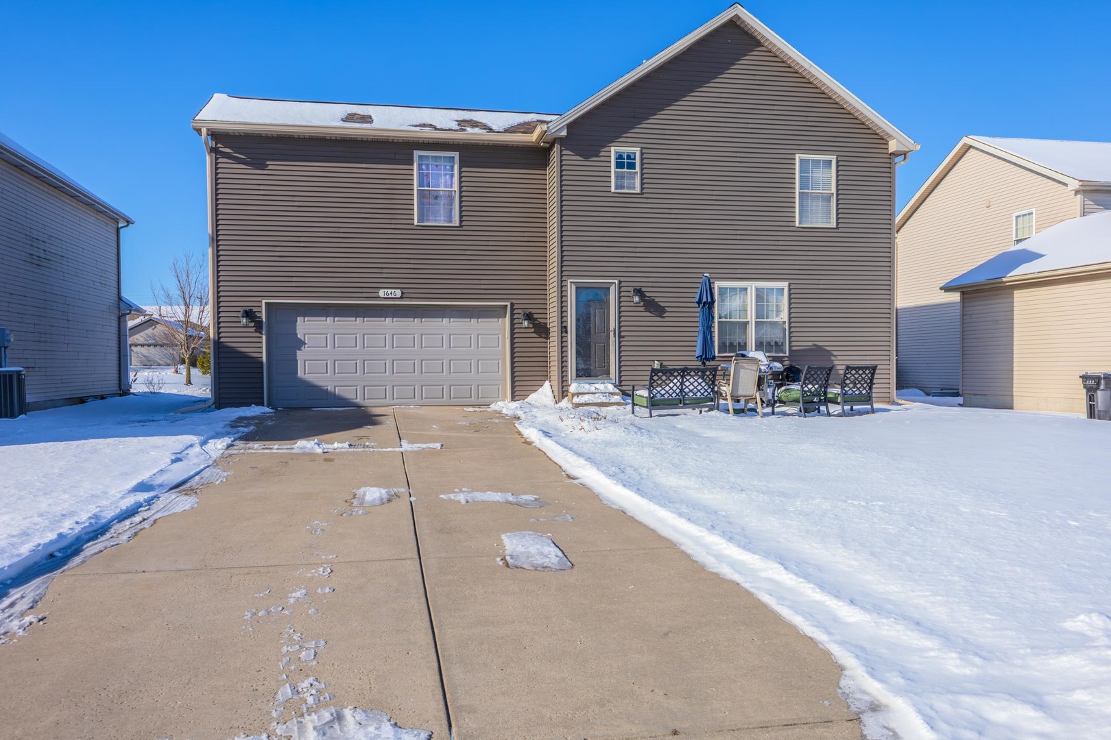 1646 Belclare Road Normal, IL 61761 - Photo 43 of 50 a backyard of a house with table and chairs