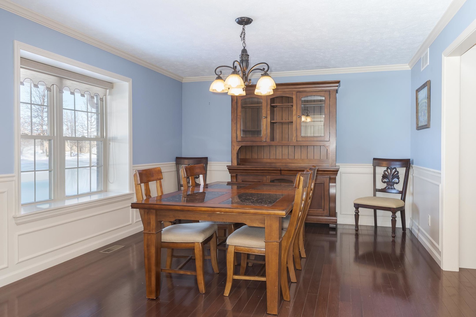 1646 Belclare Road Normal, IL 61761 - Photo 6 of 50 a dining room with furniture a chandelier and wooden floor