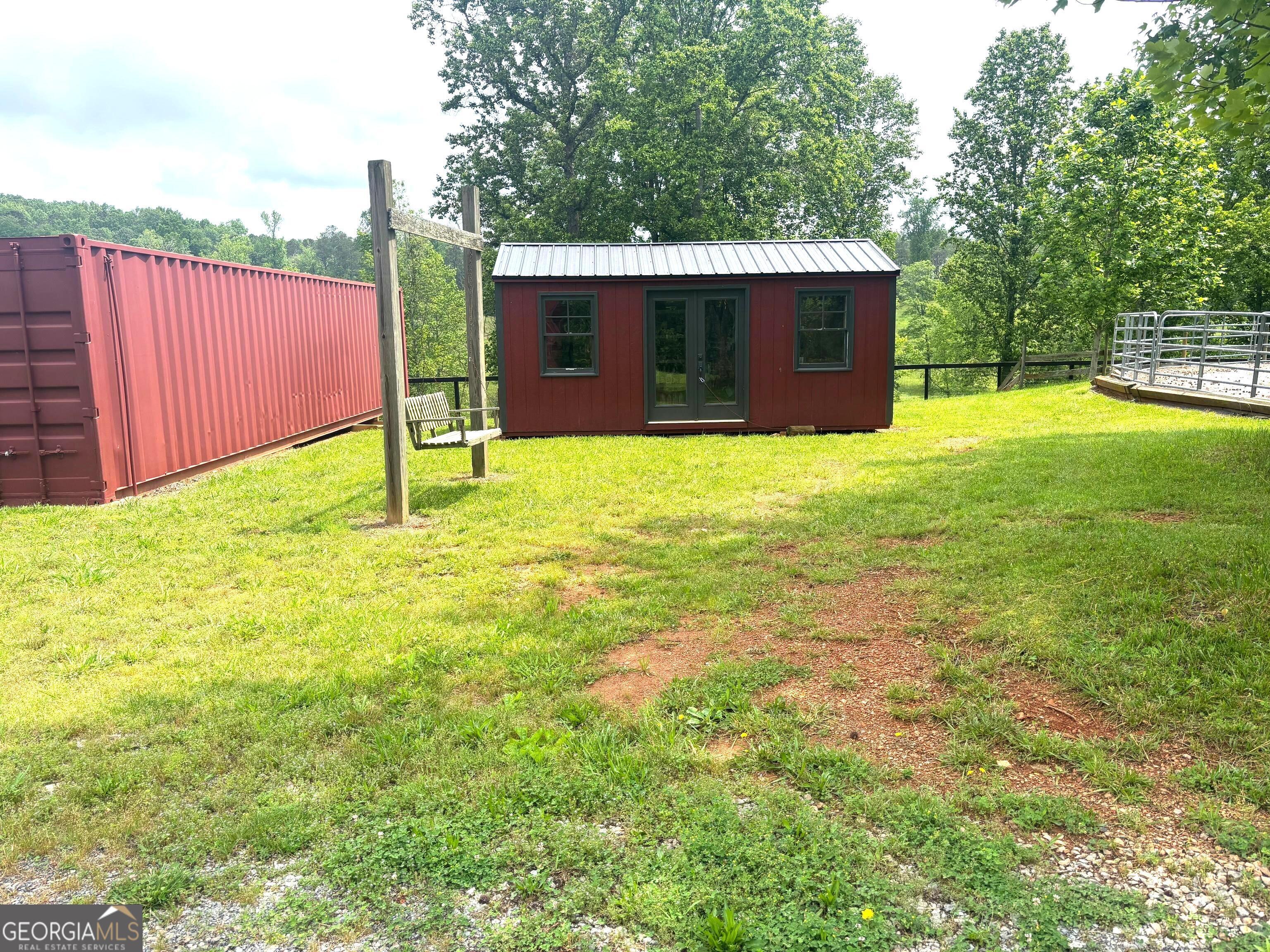 114 Addington Lane, Unit 5 Waleska, GA 30183 - Photo 17 of 31 a view of an house with backyard space and a tree