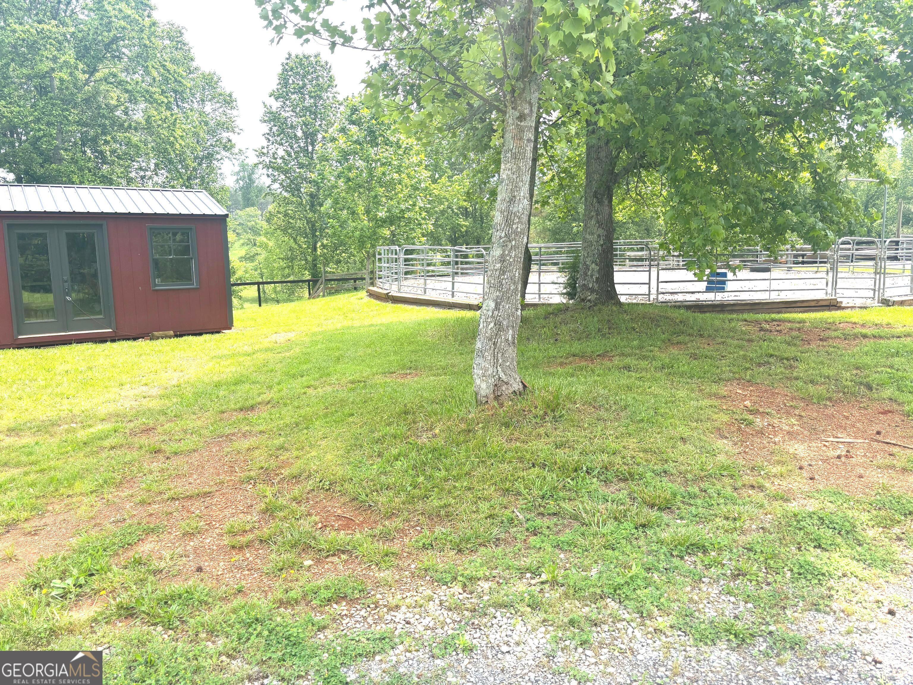 114 Addington Lane, Unit 5 Waleska, GA 30183 - Photo 17 of 35 a view of a backyard with a garden and trees