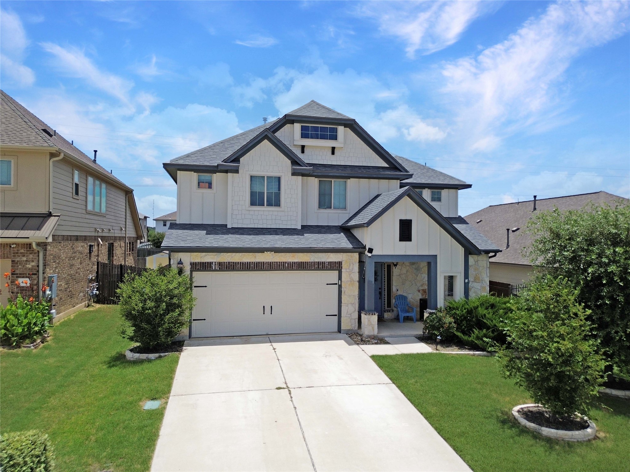 429 Rusk Bluff Avenue Leander, TX 78641 - Photo 23 of 24 Crafted with board and batten siding, this property provides ample space for relaxation and entertaining.