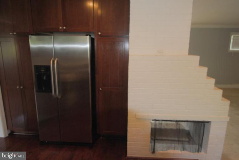 5818 Atteentee Road Springfield, VA 22150 - Photo 9 of 22 Two sided fireplace in kitchen & dining room.