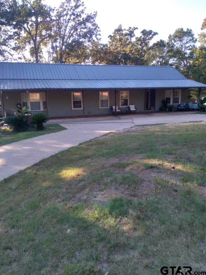 14032 Eastside Road Tyler, TX 75707 - Photo 16 of 36 a front view of a house with a yard