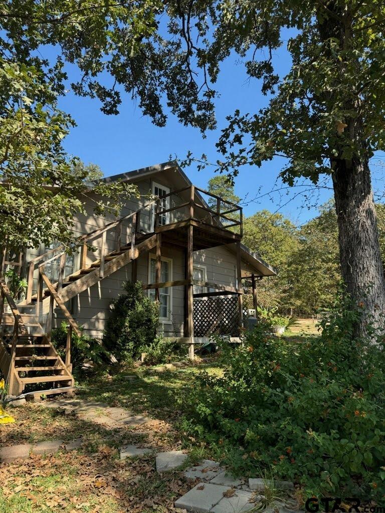14032 Eastside Road Tyler, TX 75707 - Photo 19 of 36 a view of a big yard with large trees