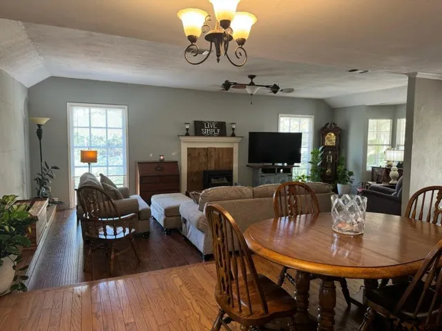 a kitchen with sink cabinets and wooden floor