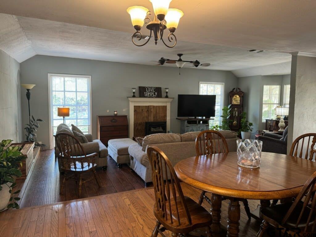 14032 Eastside Road Tyler, TX 75707 - Photo 21 of 36 a view of a dining room with furniture and wooden floor