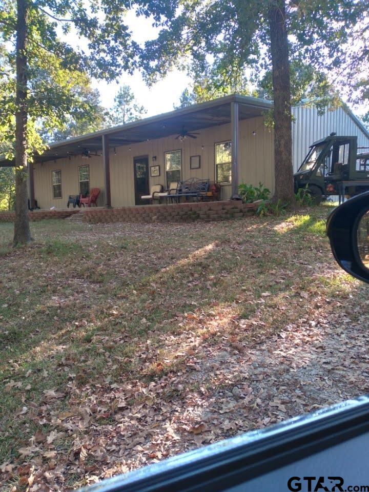 14032 Eastside Road Tyler, TX 75707 - Photo 28 of 36 front view of a house with a yard