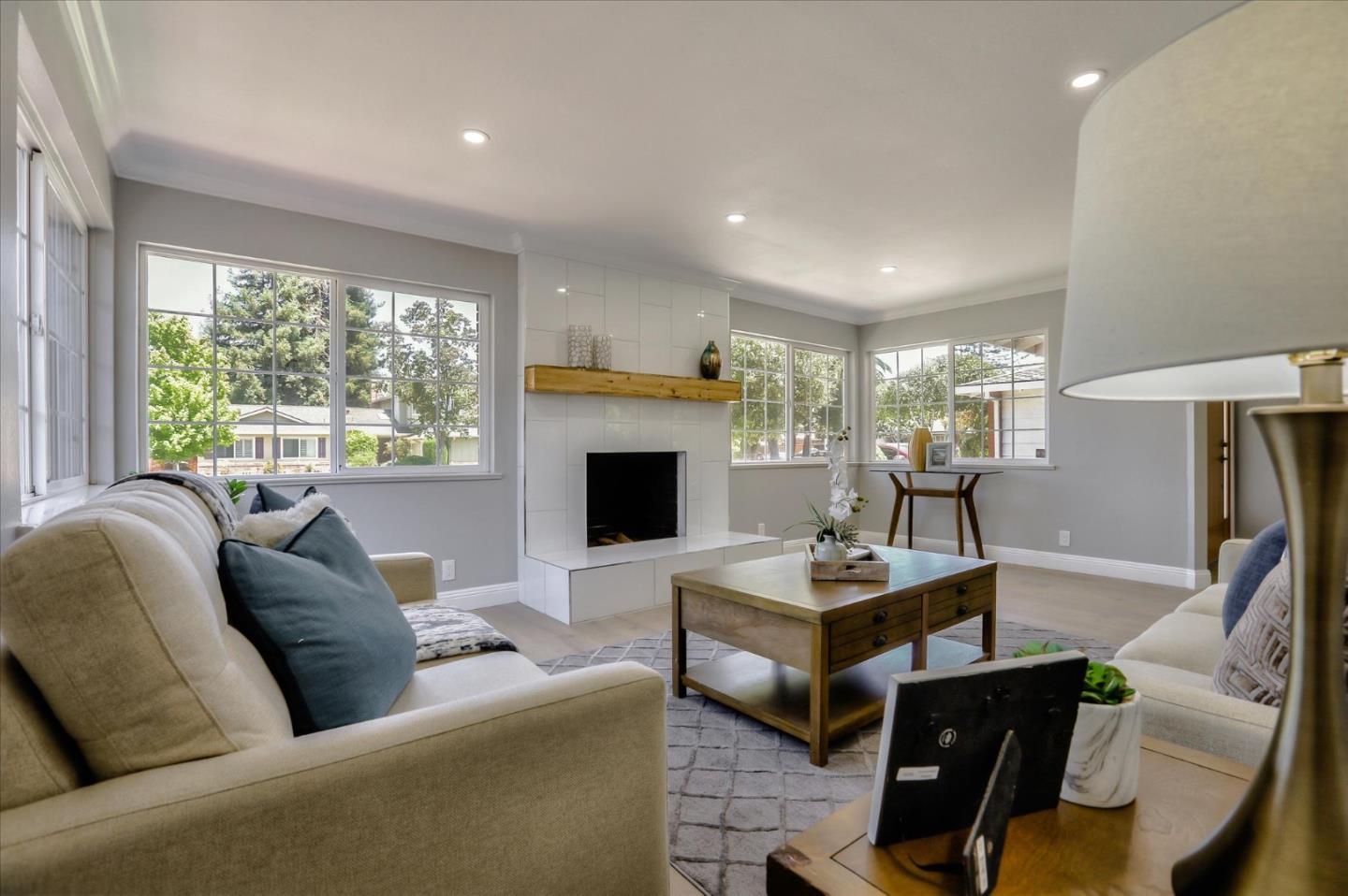1241 Wasatch Drive Mountain View, CA 94040 - Photo 16 of 66 a living room with furniture a fireplace and a large window