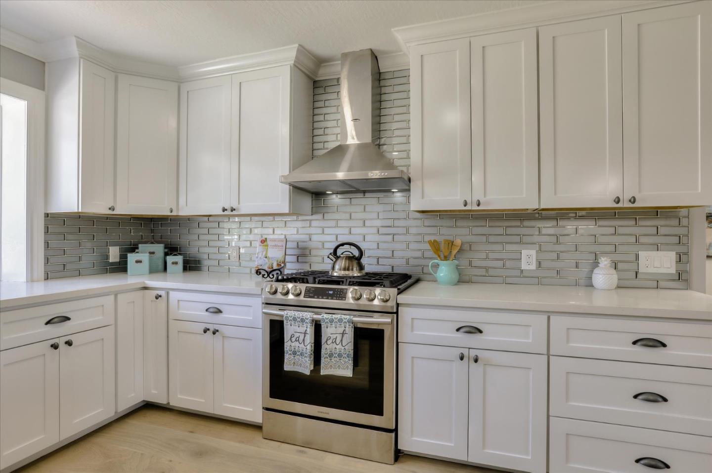 1241 Wasatch Drive Mountain View, CA 94040 - Photo 20 of 66 a kitchen with white cabinets and appliances