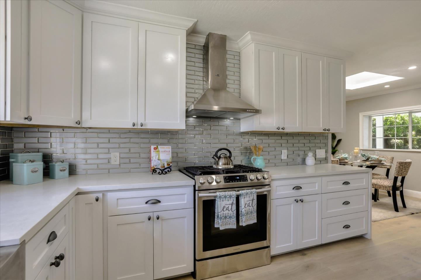 1241 Wasatch Drive Mountain View, CA 94040 - Photo 22 of 66 a kitchen with stainless steel appliances granite countertop a sink stove and cabinets