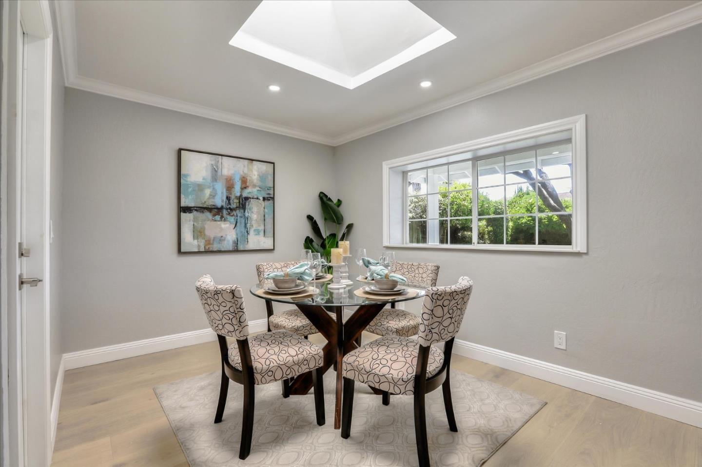 1241 Wasatch Drive Mountain View, CA 94040 - Photo 29 of 66 a dining room with furniture a rug and a potted plant