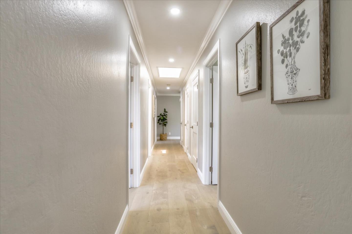 1241 Wasatch Drive Mountain View, CA 94040 - Photo 35 of 66 a view of a hallway with paintings on the wall