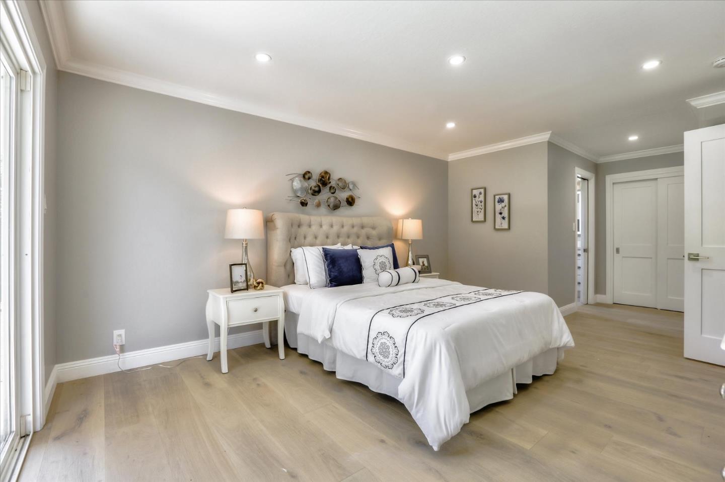 1241 Wasatch Drive Mountain View, CA 94040 - Photo 38 of 66 a bedroom with a bed and a chandelier