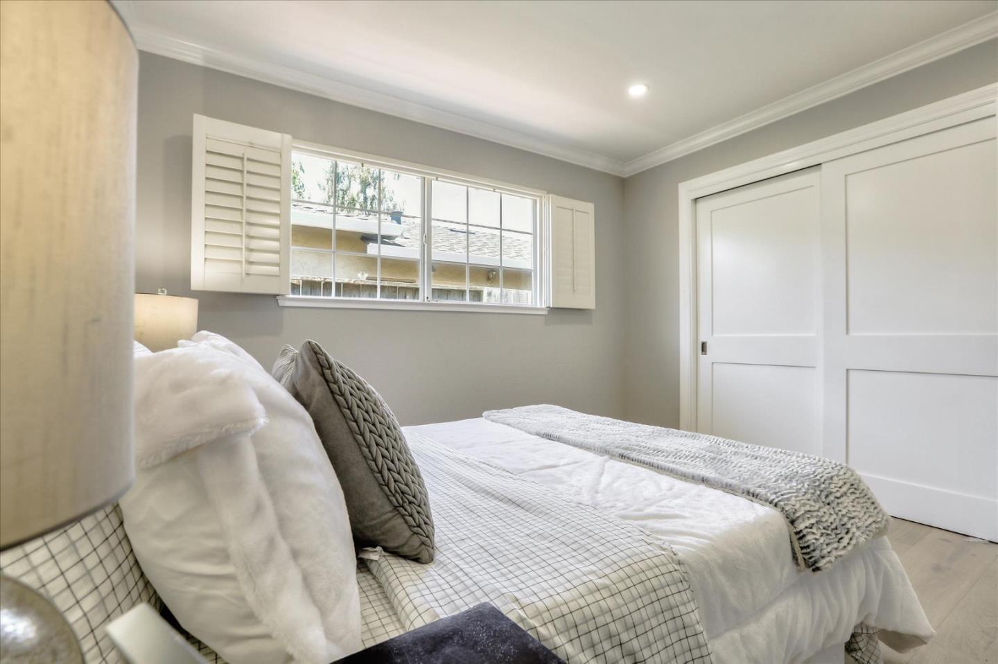 1241 Wasatch Drive Mountain View, CA 94040 - Photo 47 of 66 a bedroom with a bed and a large window