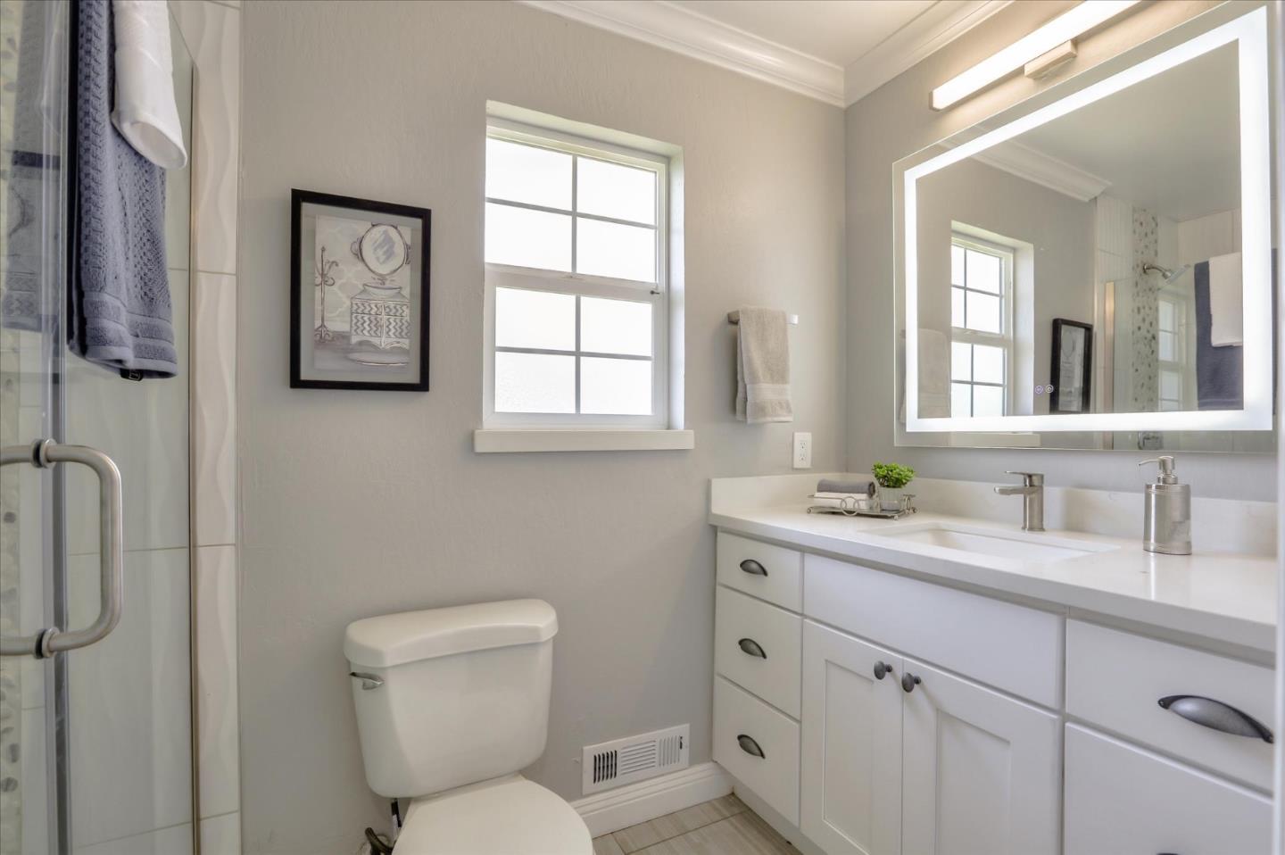 1241 Wasatch Drive Mountain View, CA 94040 - Photo 48 of 66 a bathroom with a toilet sink and mirror
