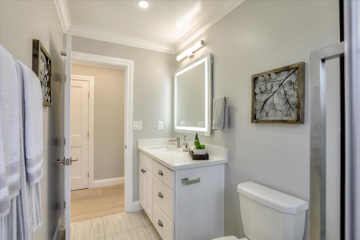 1241 Wasatch Drive Mountain View, CA 94040 - Photo 52 of 66 a bathroom with a sink a toilet and a mirror