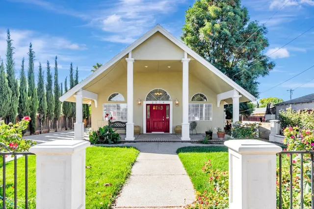 a front view of a house with garden