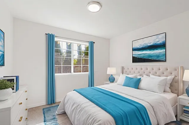 a bathroom with a sink a mirror a toilet and a window