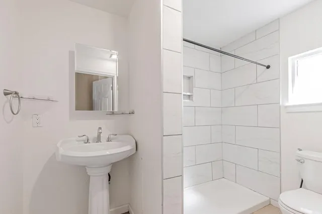 a kitchen that has a sink and a stove