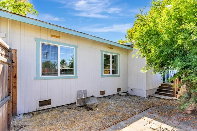 a backyard of a house with seating space
