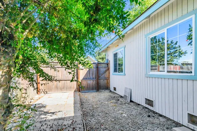 a kitchen with a sink a stove top oven and cabinets