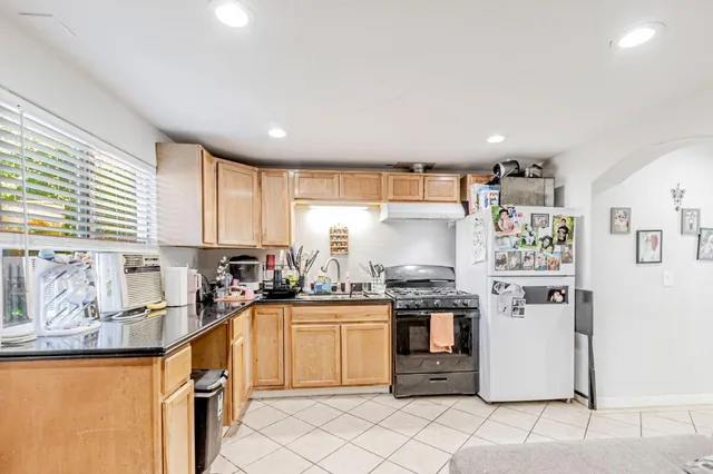 a view of a hallway view with wooden floor and bathroom