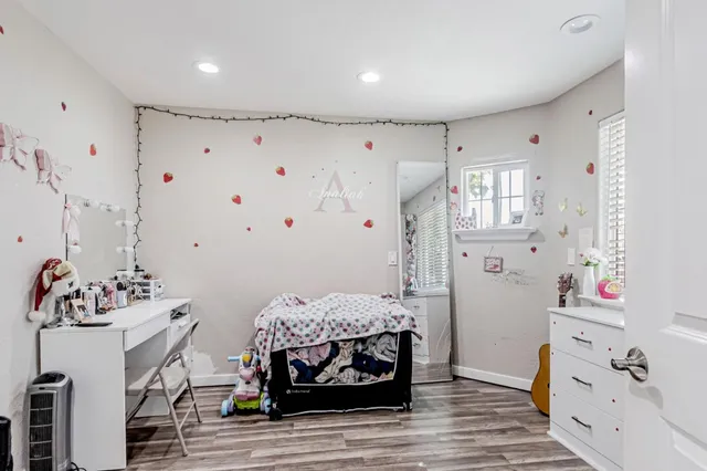 a bedroom with a bed and cabinets