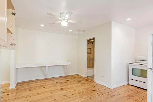 a bathroom with a sink mirror vanity and toilet
