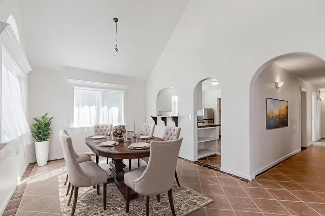 a kitchen with stainless steel appliances granite countertop a stove sink and cabinets