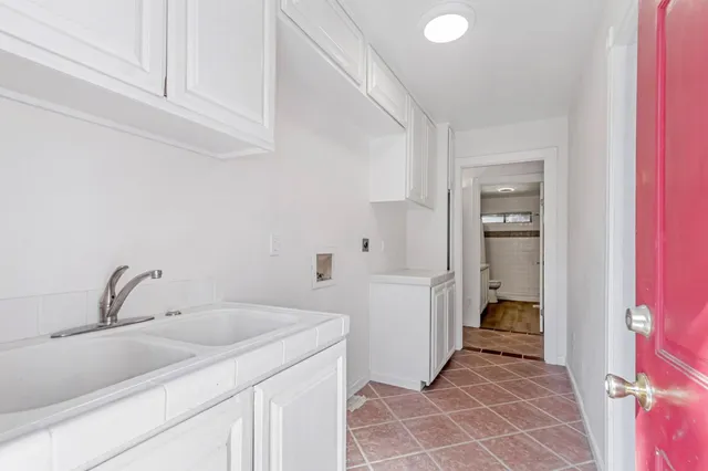 a bedroom with bed and a window