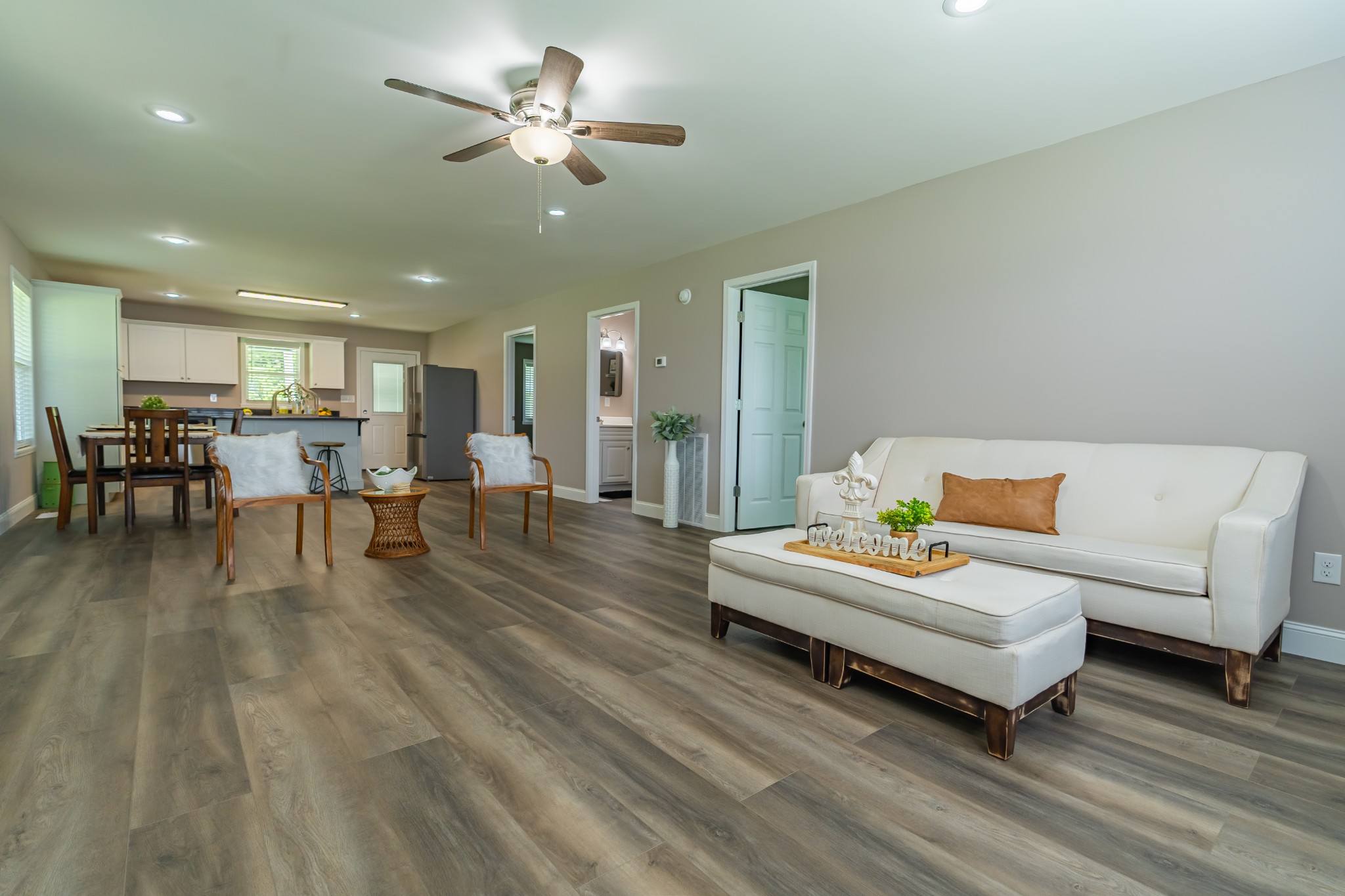 34 Bailey Road Decherd, TN 37324 - Photo 12 of 27 a living room with furniture and a dining table with wooden floor